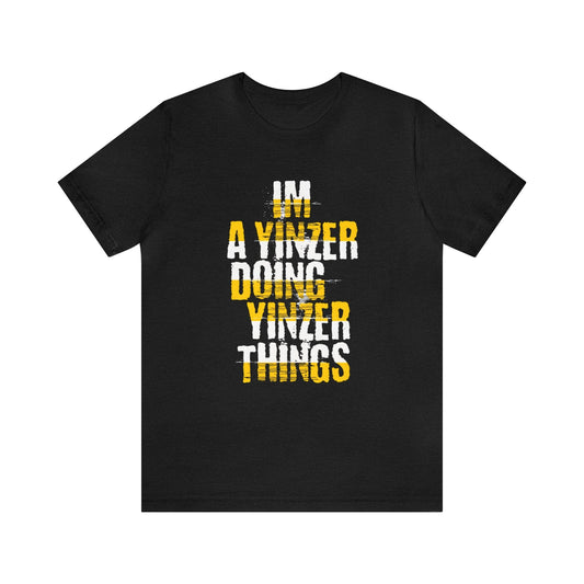 Black t-shirt with bold yellow and white “I'm a Yinzer Doing Yinzer Things” text – Pittsburgh slang shirt for Yinzers